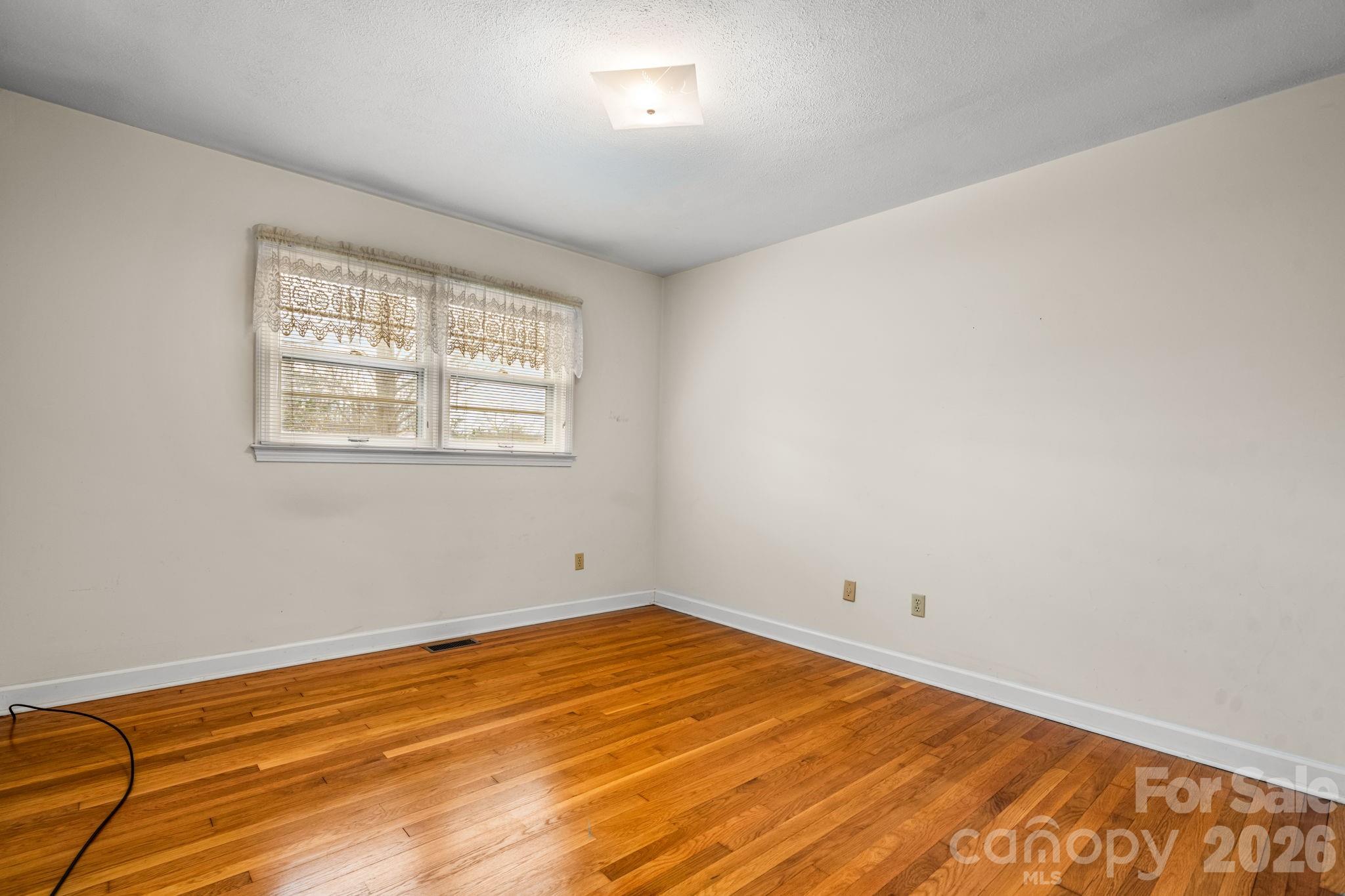 1200 Piedmont Road Morganton, NC 28655 - Photo 13 of 27 a view of a room with wooden floor and natural light