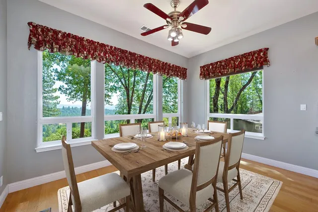 a view of a dining room with furniture window and outside view