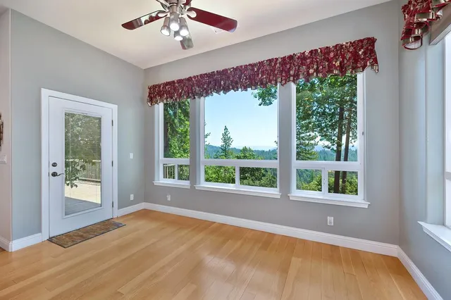 a view of a balcony with a tree