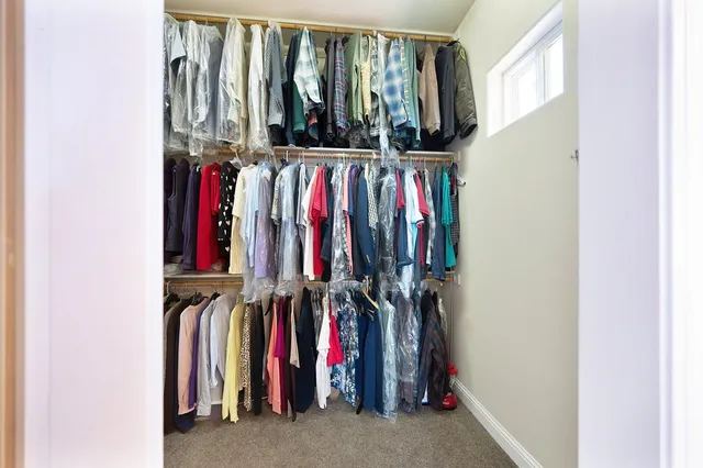a spacious bathroom with a double vanity sink and a large mirror