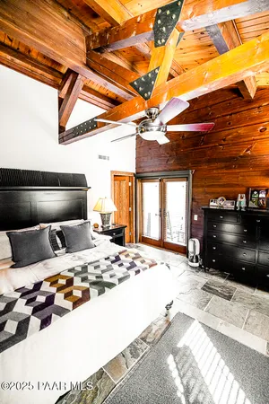 a large kitchen with stainless steel appliances granite countertop a sink a stove and a wooden cabinets