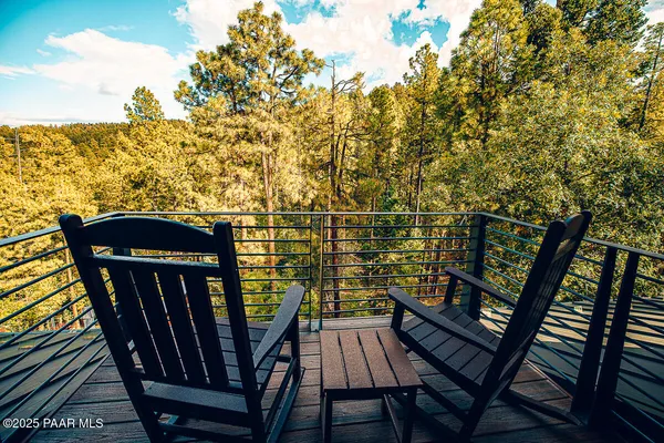 a dining hall with stainless steel appliances granite countertop a stove and large window
