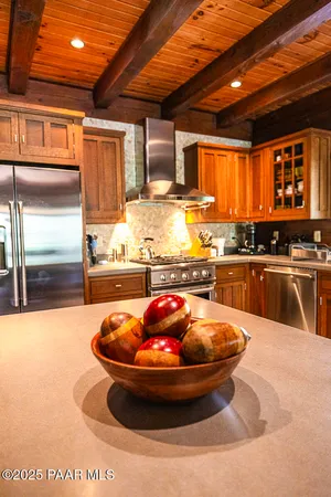 a living room with lots of furniture and a book shelf