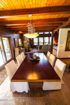 a view of a chairs and table on the patio