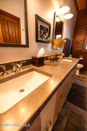 a backyard of a house with a tree