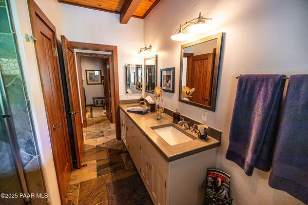 a view of a backyard with table and chairs and a potted plant