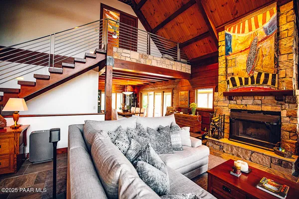 a view of balcony with wooden floor and outdoor seating