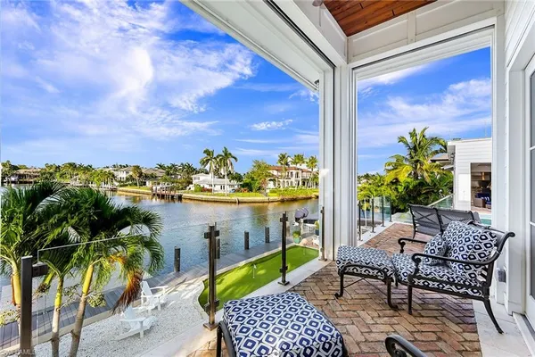 a view of a chairs and table in patio
