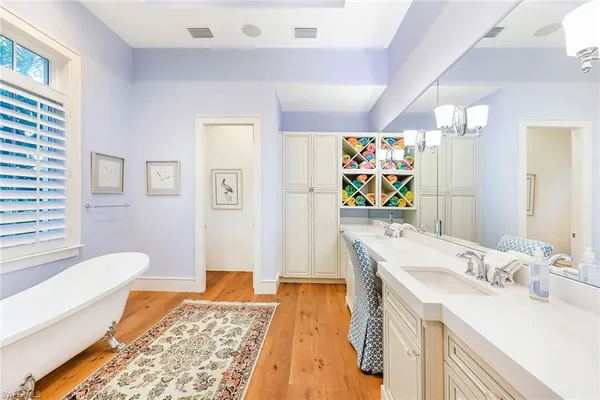 a bath room with a sink and a mirror