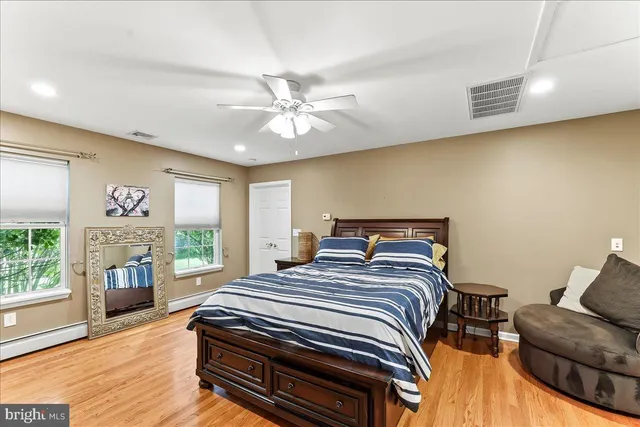 a bedroom with a bed and a fireplace