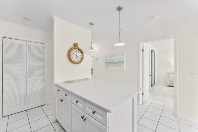 a view of a hallway with cabinet door