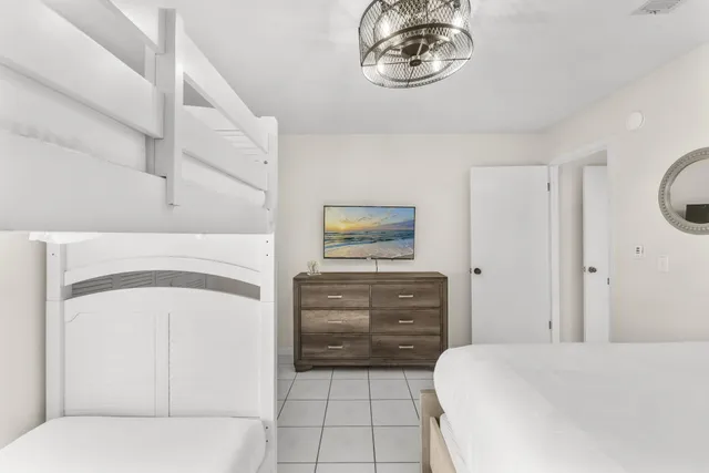 a bedroom with a bed and cabinets