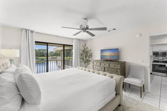 a bedroom with a large bed and a tv