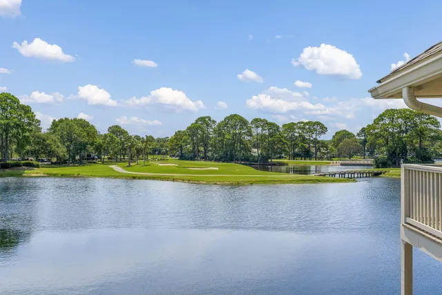 a view of a swimming pool and a yard