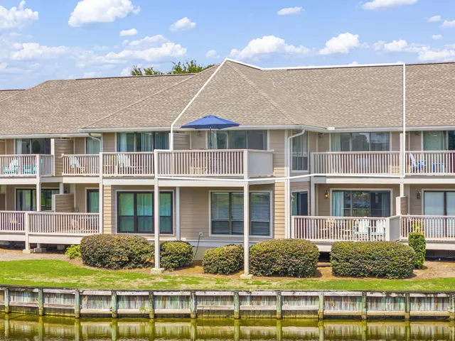 a house with palm tree in front of it