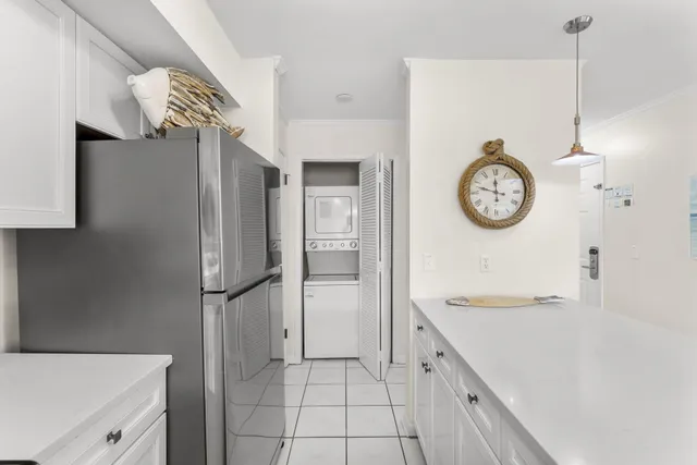 a spacious bathroom with a sink and a clock