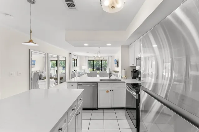 a kitchen with sink cabinets and window