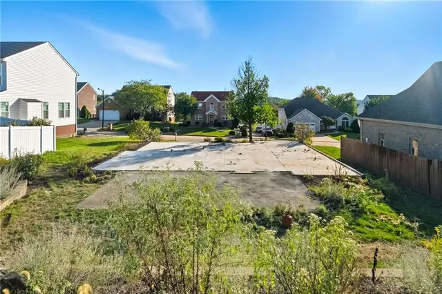a view of yard with swimming pool and outdoor seating