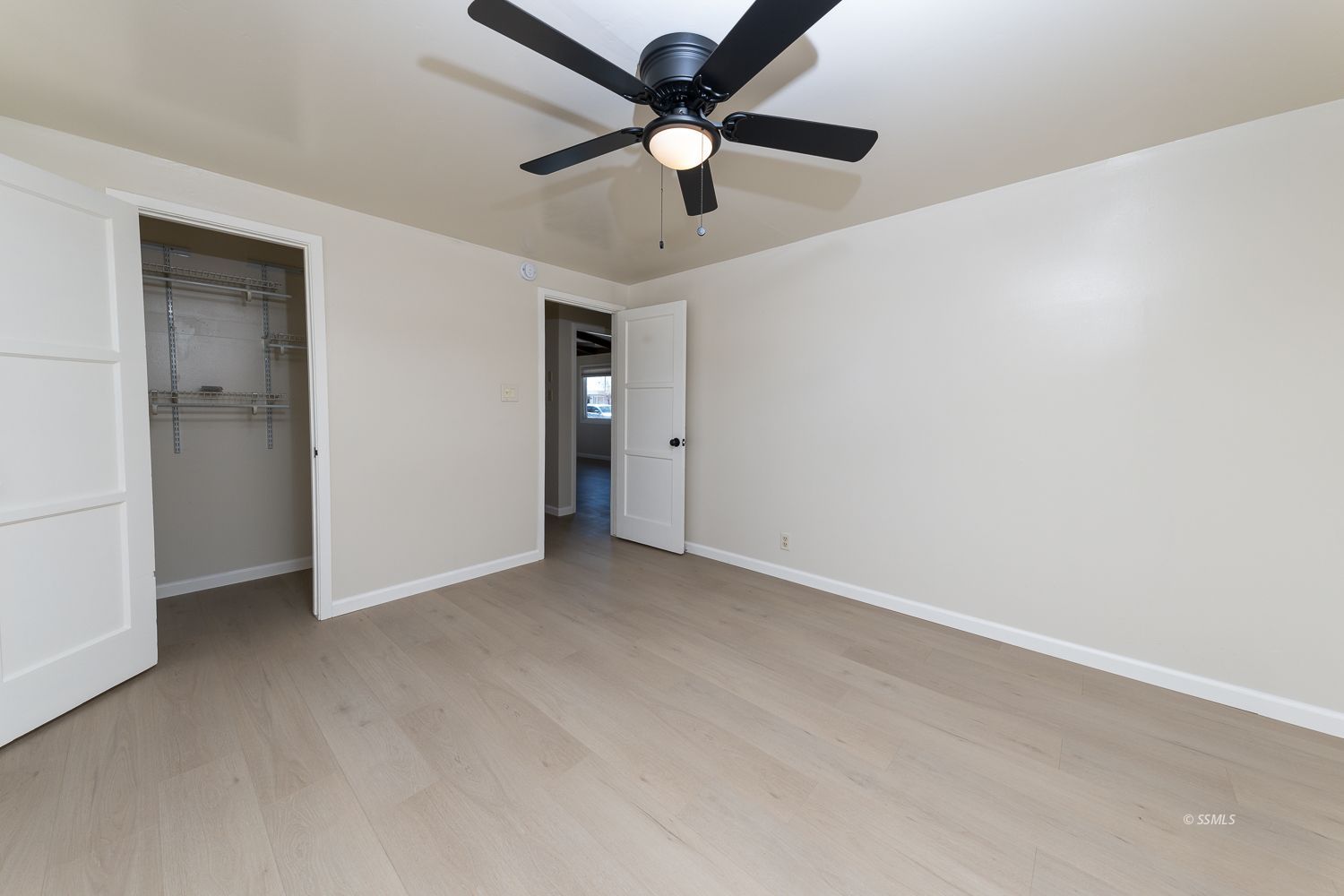424 North Norma Street Ridgecrest, CA 93555 - Photo 14 of 27 an empty room with a ceiling fan and carpet