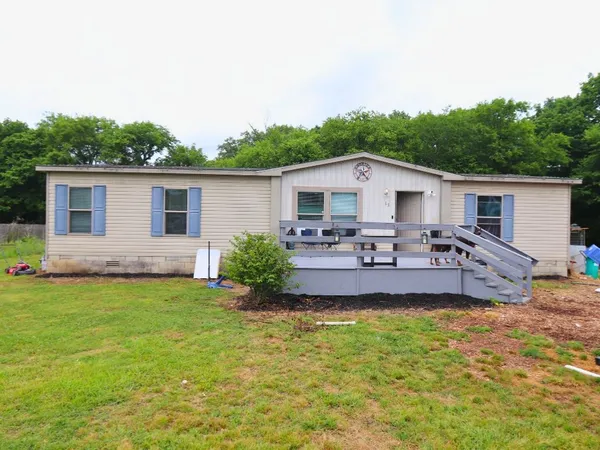 a front view of house with yard and seating area