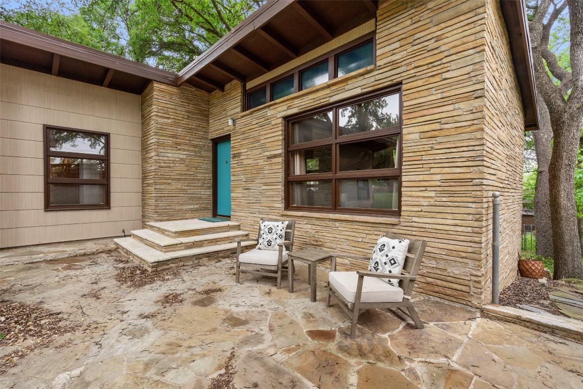 Welcome to this iconic mid-century modern home by iconic local architect AD Stenger, This front patio is the best place to watch the world go by in Barton Hills