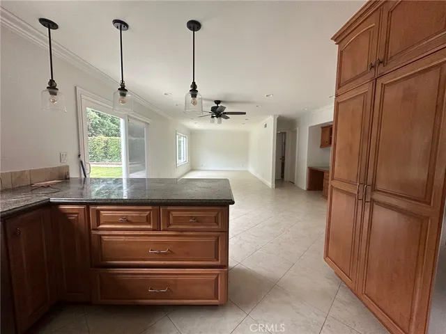 a kitchen with refrigerator a sink and cabinets
