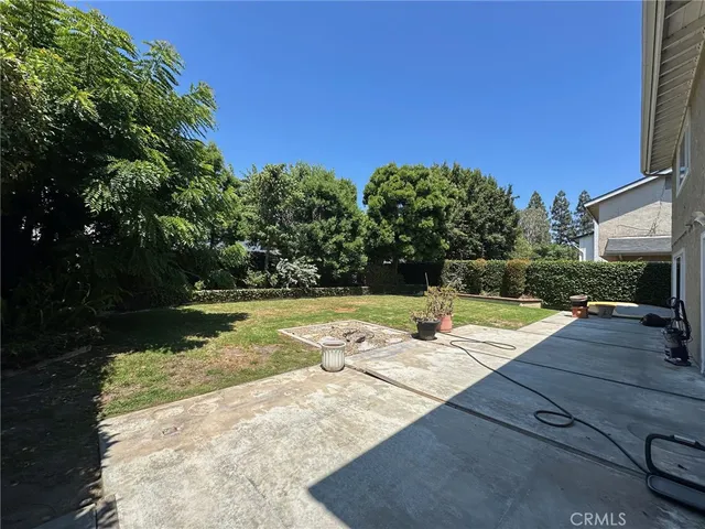 a view of a swimming pool with an outdoor space and seating area