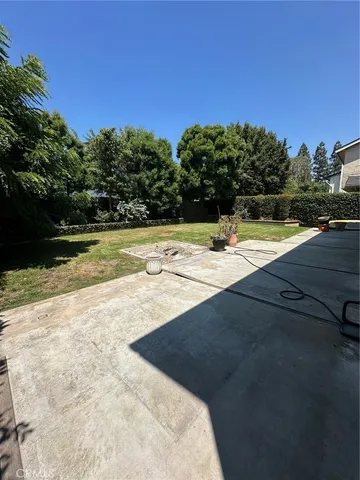 a view of a swimming pool with an outdoor space and seating area