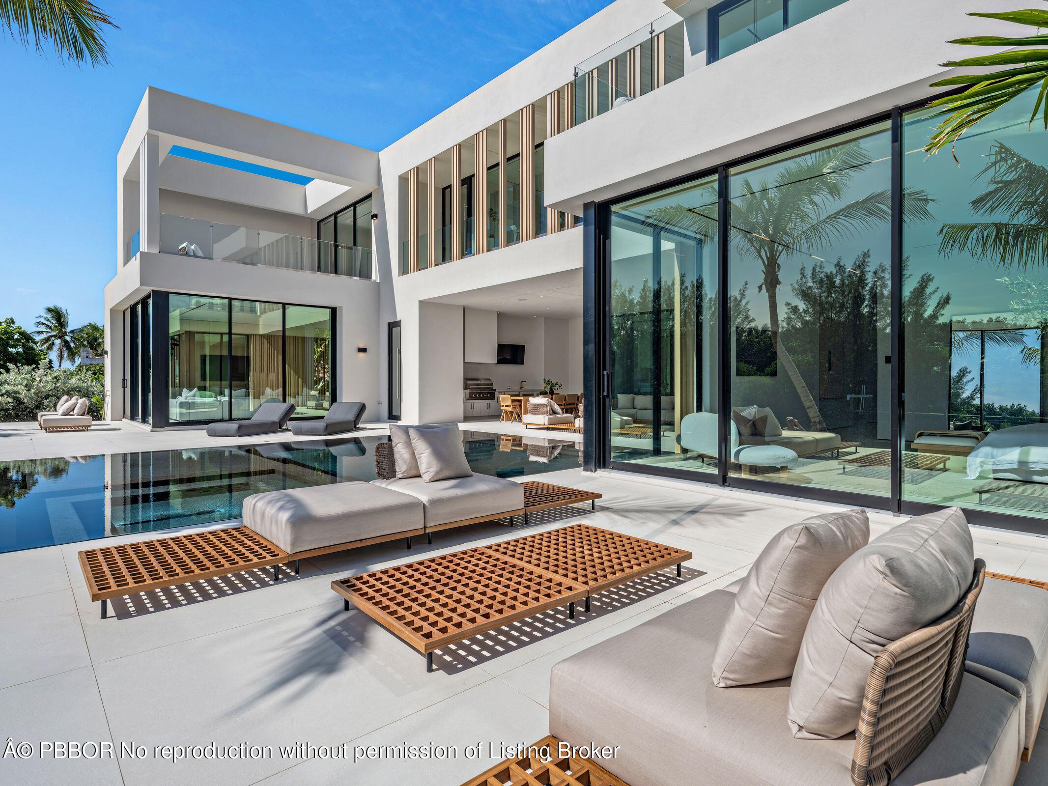35 Spoonbill Road Manalapan, FL 33462 - Photo 20 of 27 a view of outdoor space yard swimming pool and furniture