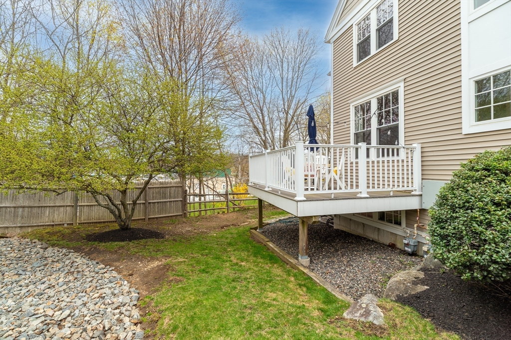 6 Essex Road, Unit 8 Ipswich, MA 01938 - Photo 30 of 35 a view of a house with backyard and a bench