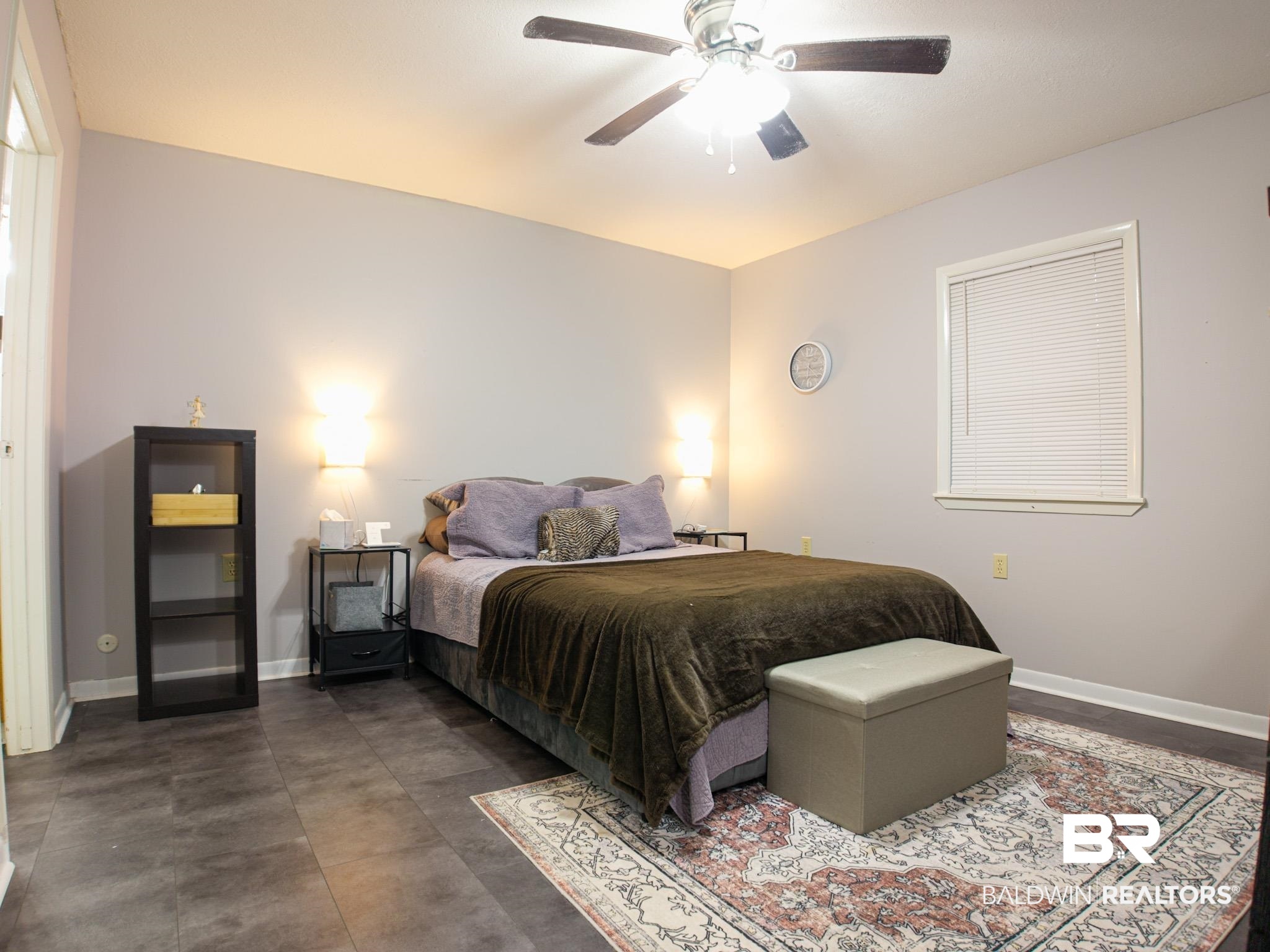 1563 Valencia Drive Lillian, AL 36549 - Photo 14 of 27 Bedroom featuring baseboards and ceiling fan