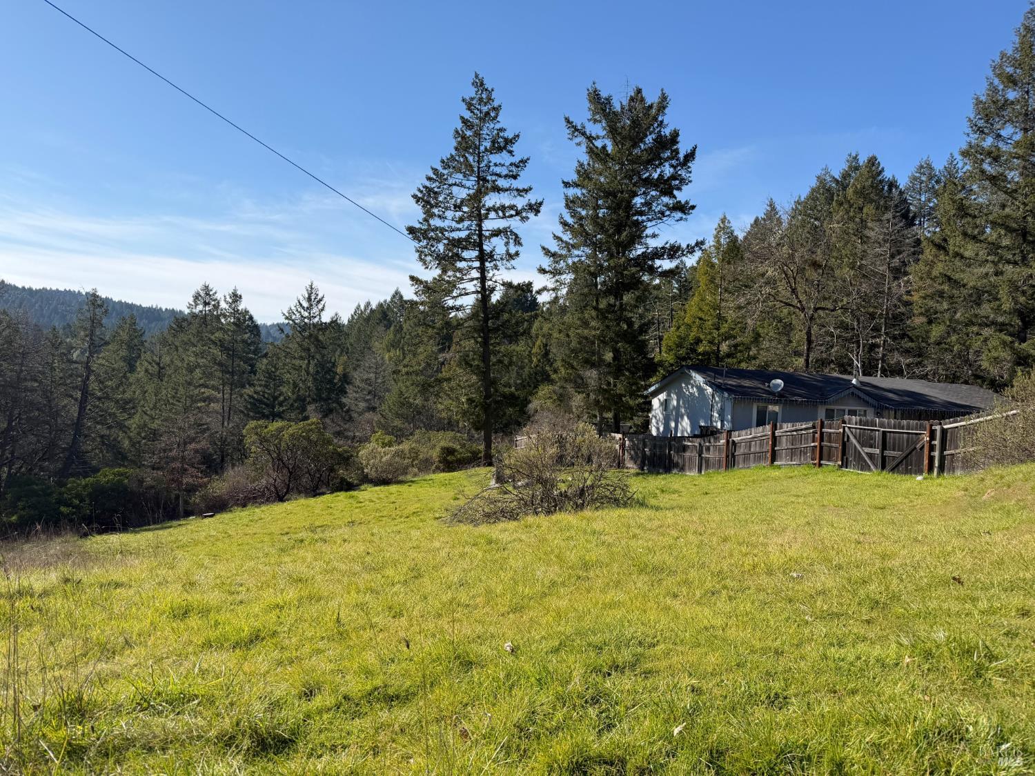 26600 Sherwood Road Willits, CA 95490 - Photo 3 of 10 a backyard of a house with yard and outdoor seating