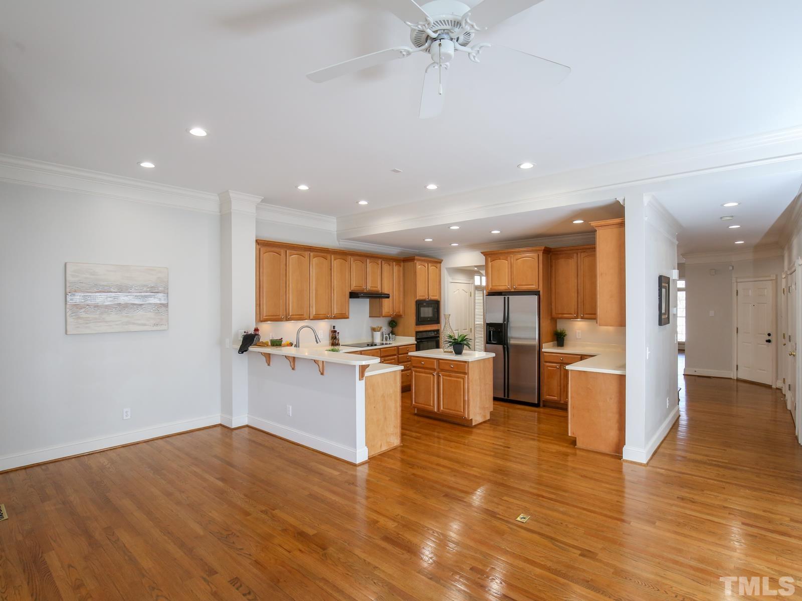 3905 Bentley Meadow Lane Raleigh, NC 27612 - Photo 12 of 40 a kitchen with lots of counter top space and stainless steel appliances