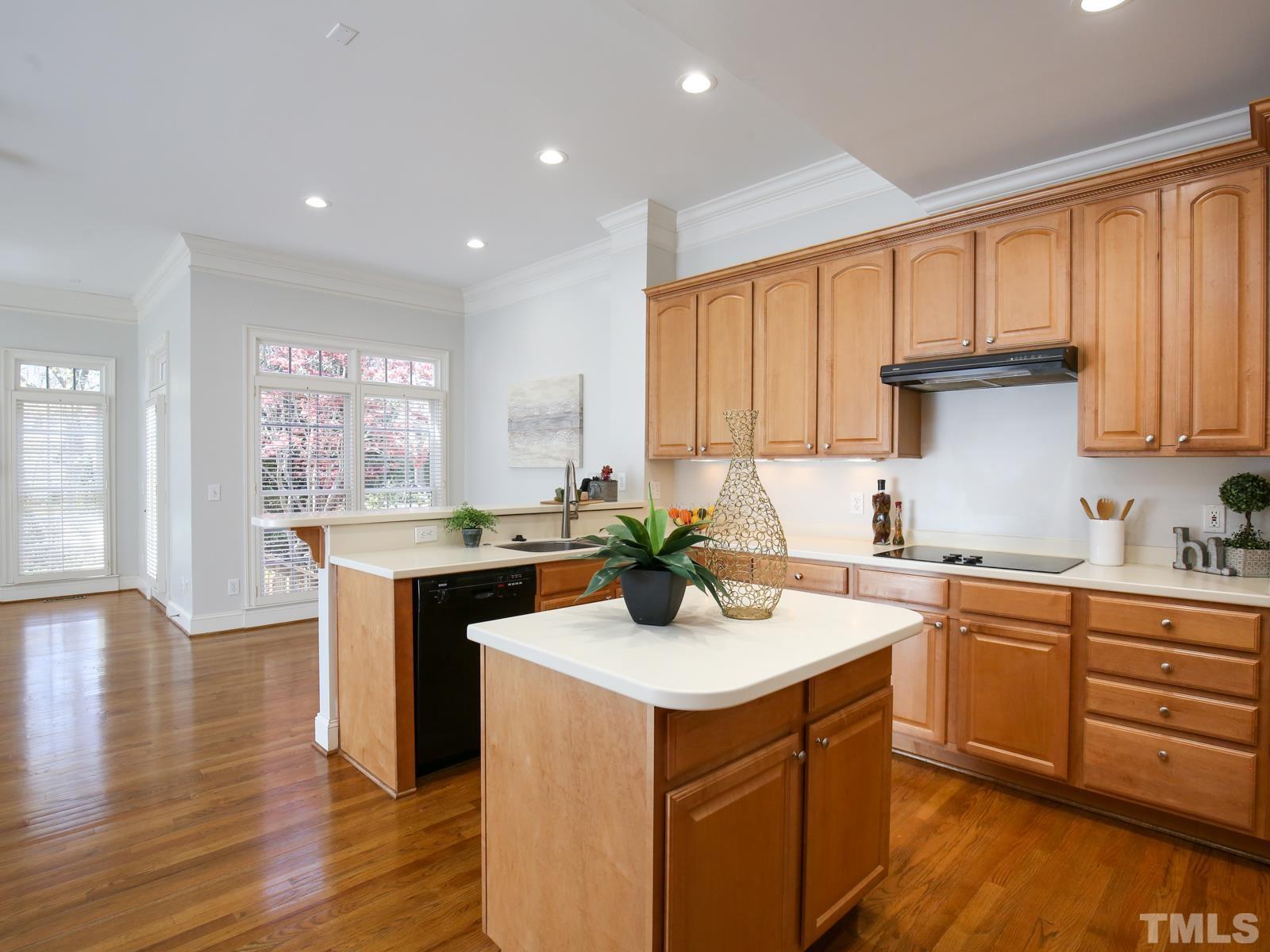 3905 Bentley Meadow Lane Raleigh, NC 27612 - Photo 16 of 40 a kitchen with a sink stove and cabinets
