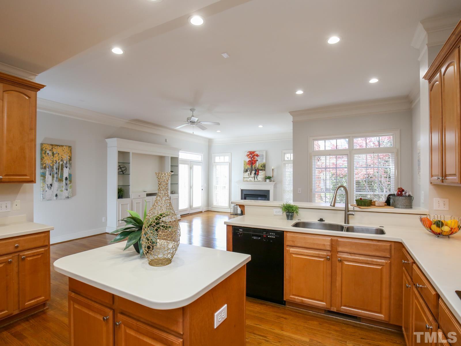 3905 Bentley Meadow Lane Raleigh, NC 27612 - Photo 21 of 40 a kitchen with a sink stove and cabinets