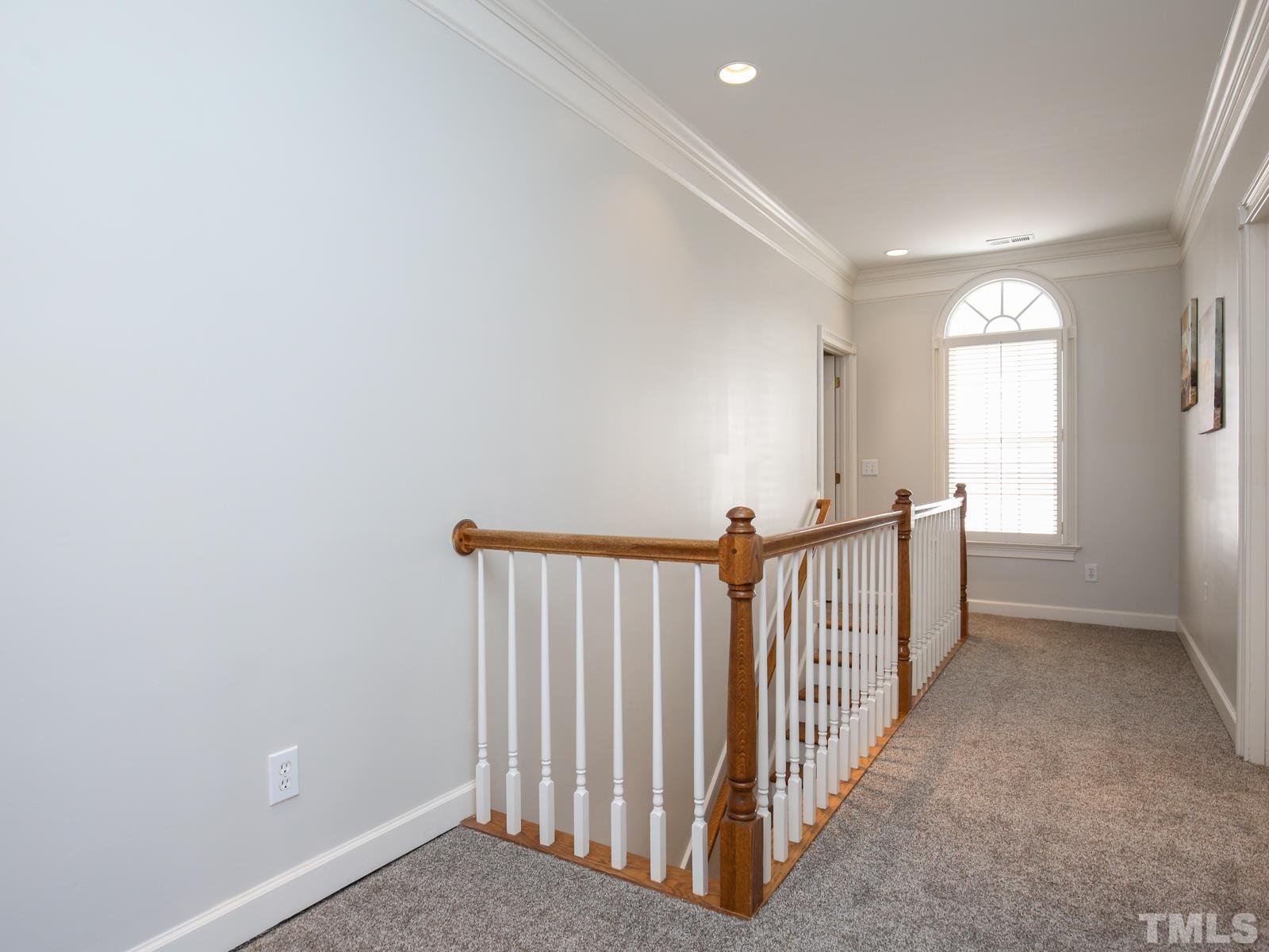 3905 Bentley Meadow Lane Raleigh, NC 27612 - Photo 26 of 40 a view of a hallway with a window