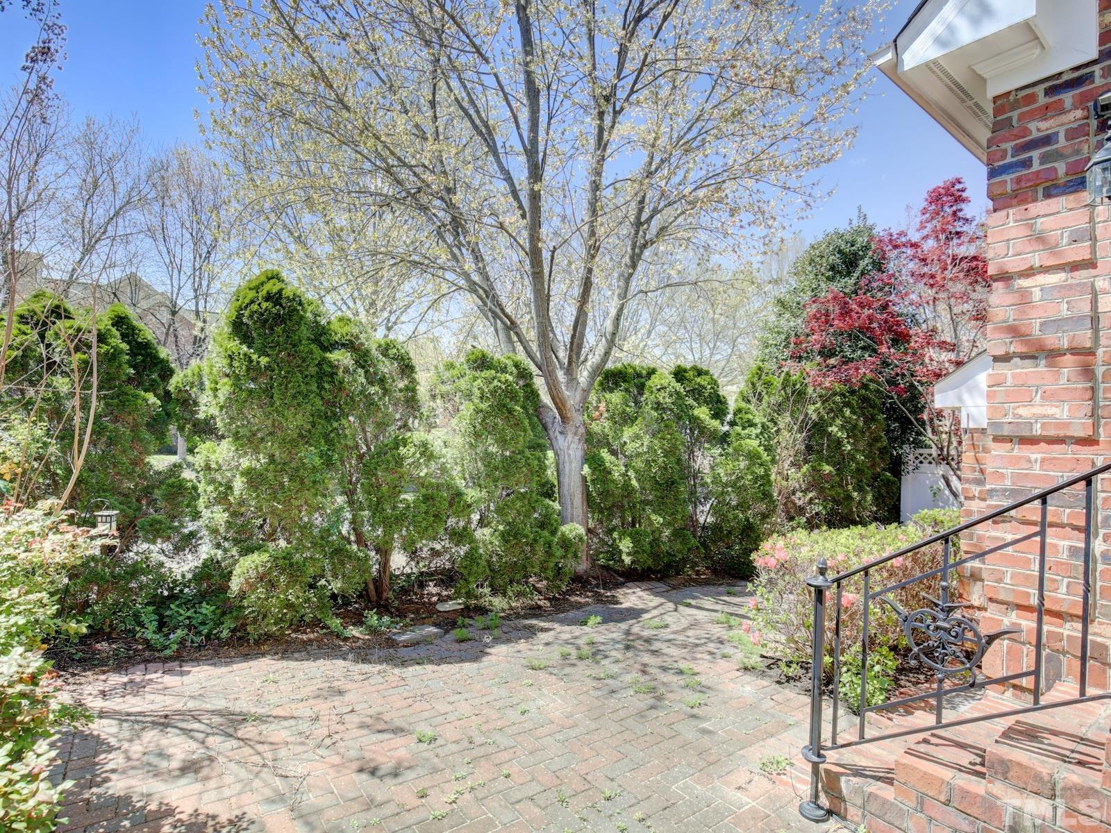3905 Bentley Meadow Lane Raleigh, NC 27612 - Photo 38 of 40 a view of a yard with plants and trees