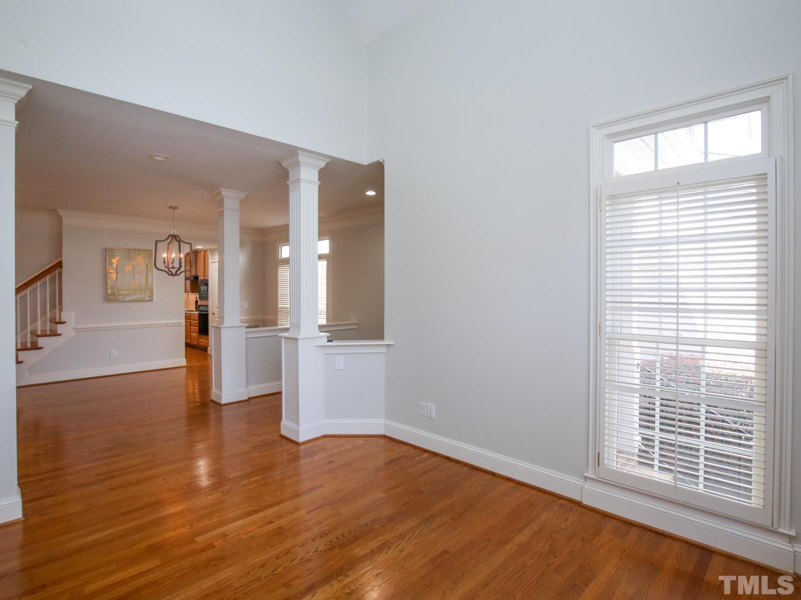 3905 Bentley Meadow Lane Raleigh, NC 27612 - Photo 6 of 40 wooden floor in an empty room with a window