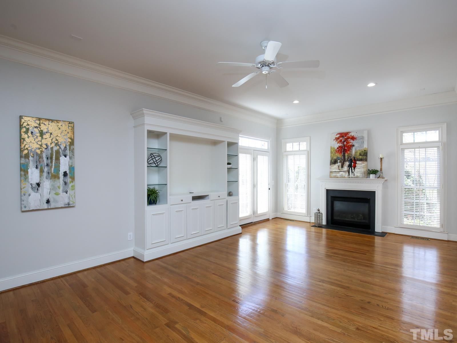 3905 Bentley Meadow Lane Raleigh, NC 27612 - Photo 9 of 40 a view of an empty room with wooden floor and a window