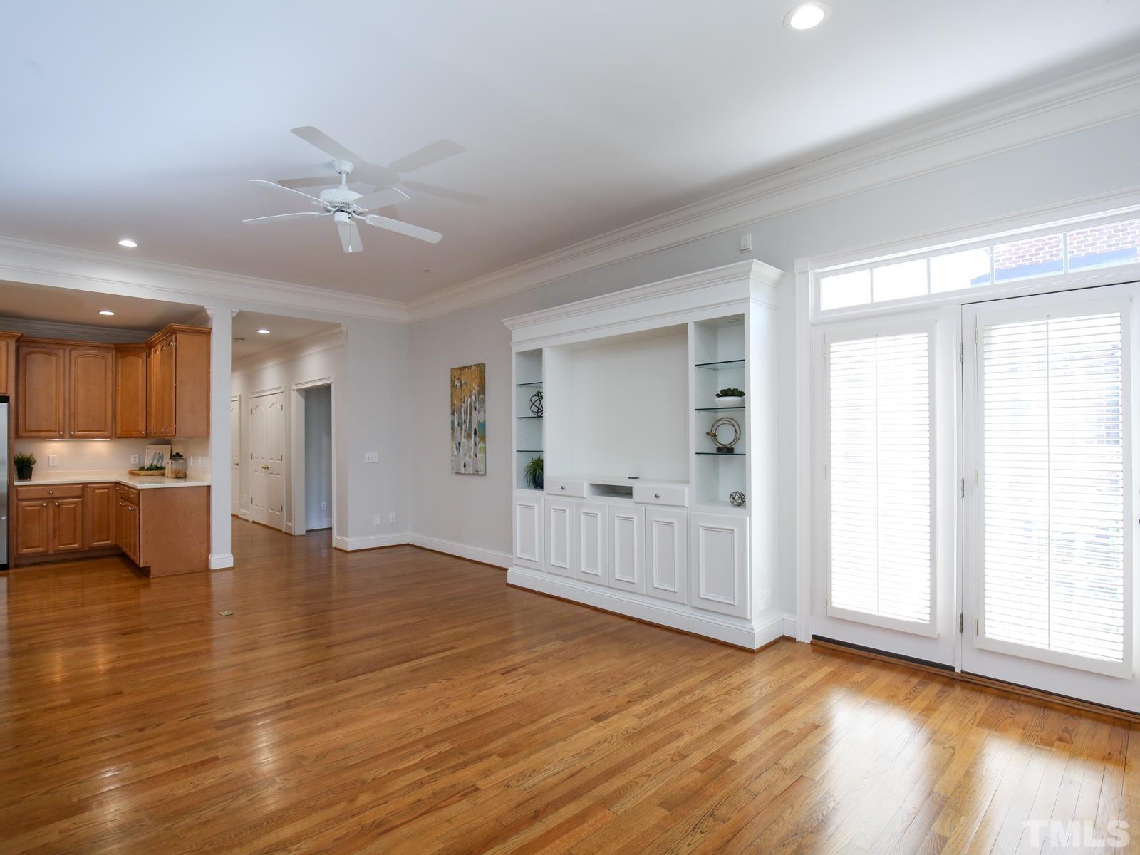 3905 Bentley Meadow Lane Raleigh, NC 27612 - Photo 10 of 40 a view of an empty room with wooden floor and a window