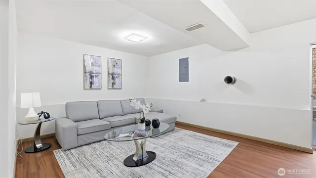 a living room with furniture and a rug