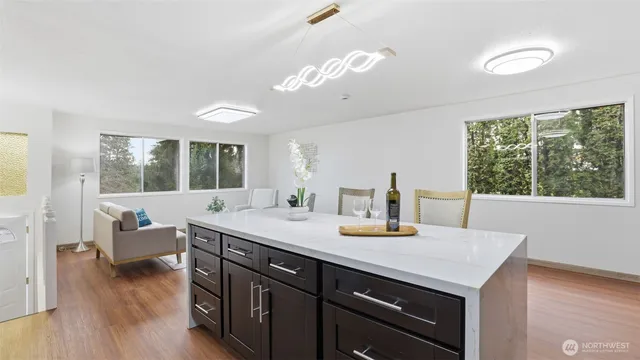 a dining room with a large window and couch