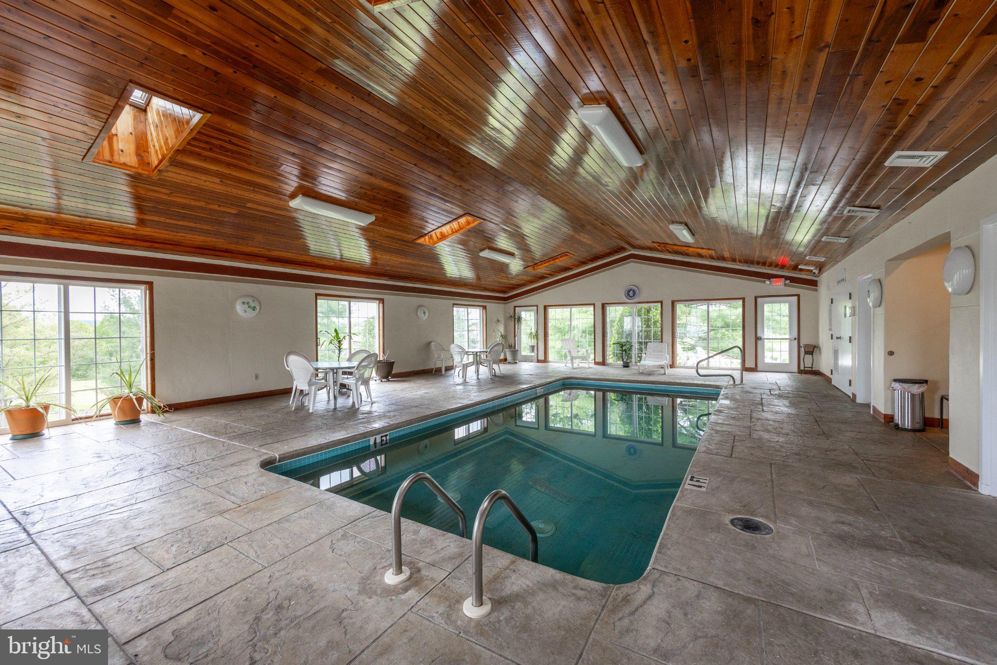 331 Brandon Road Norristown, PA 19403 - Photo 27 of 44 Serene indoor pool with wooden accents.