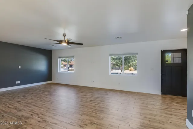 a bathroom with a sink toilet vanity and shower