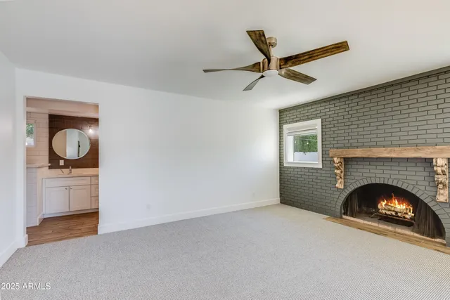 a bathroom with a shower and a glass door