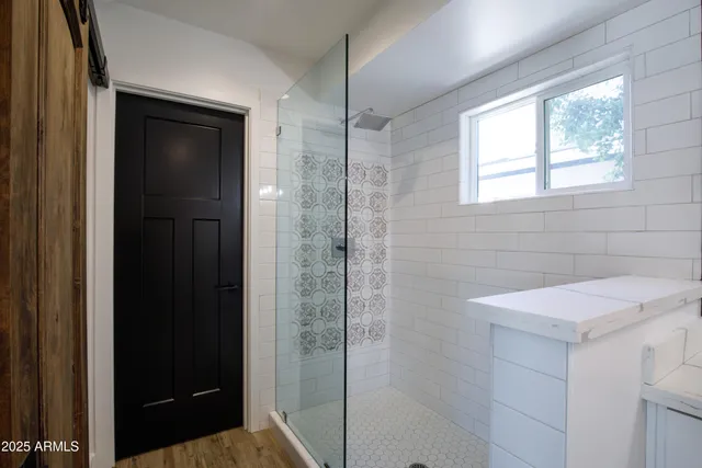 a view of an empty room with windows