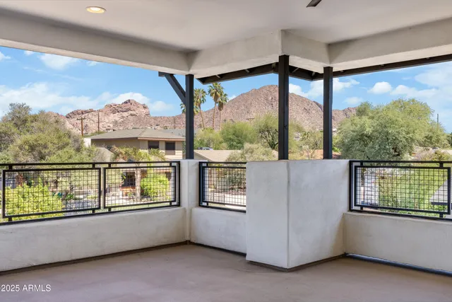 a view of a swimming pool with an outdoor seating