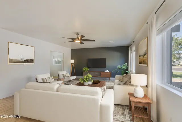 a living room with furniture and a flat screen tv