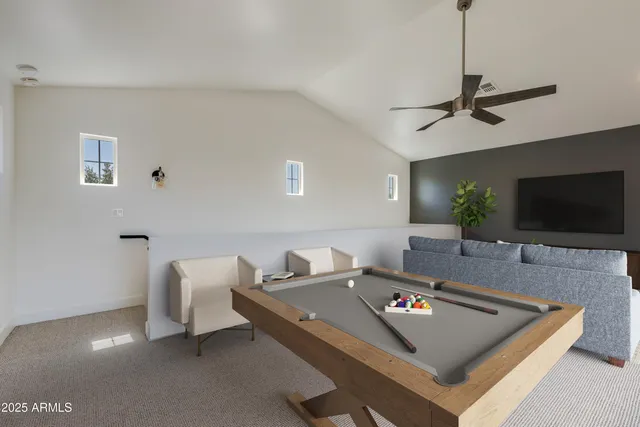 a kitchen with stainless steel appliances kitchen island a refrigerator sink and cabinets