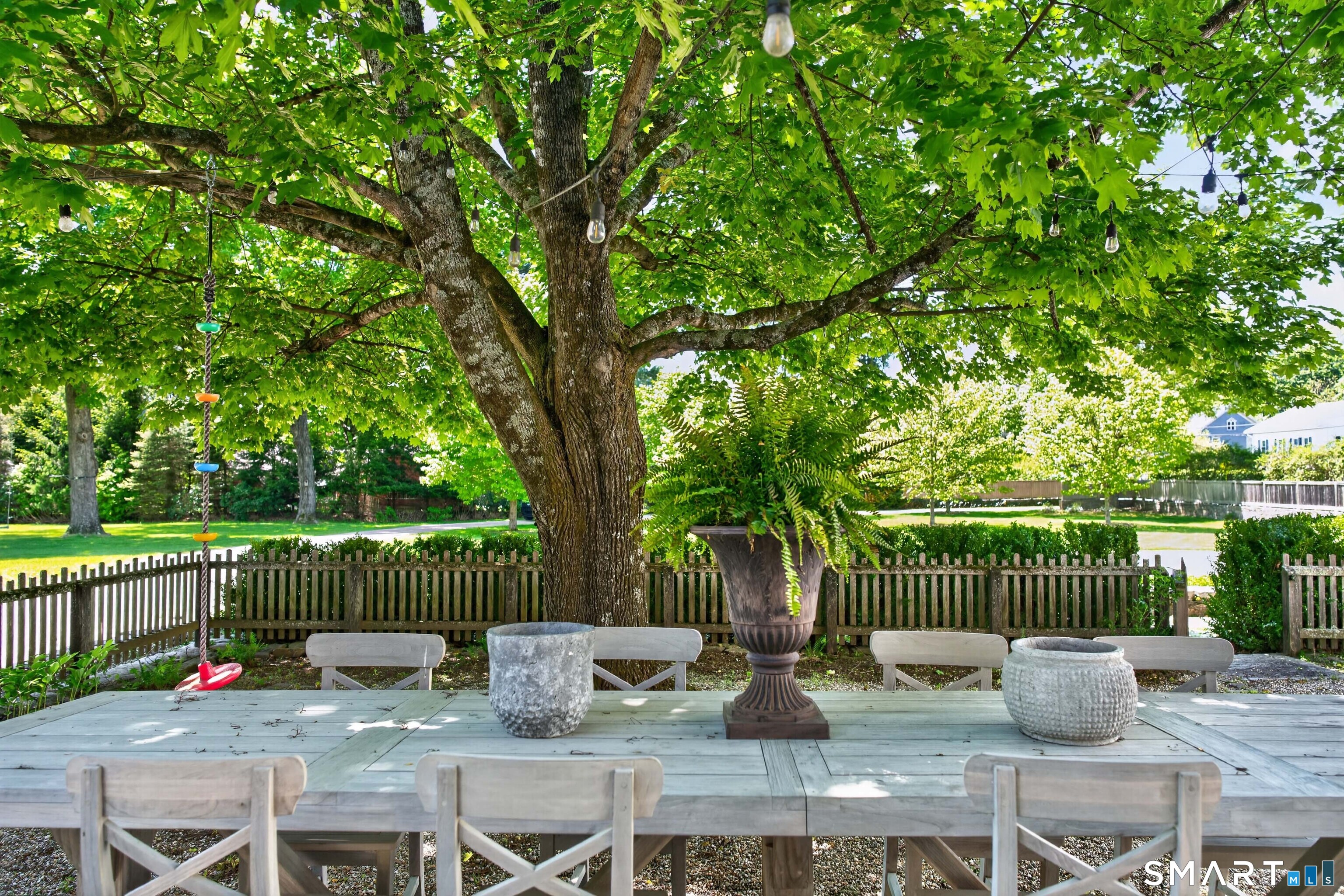 100 North Main Street Kent, CT 06757 - Photo 7 of 40 a view of a table and chairs on the deck